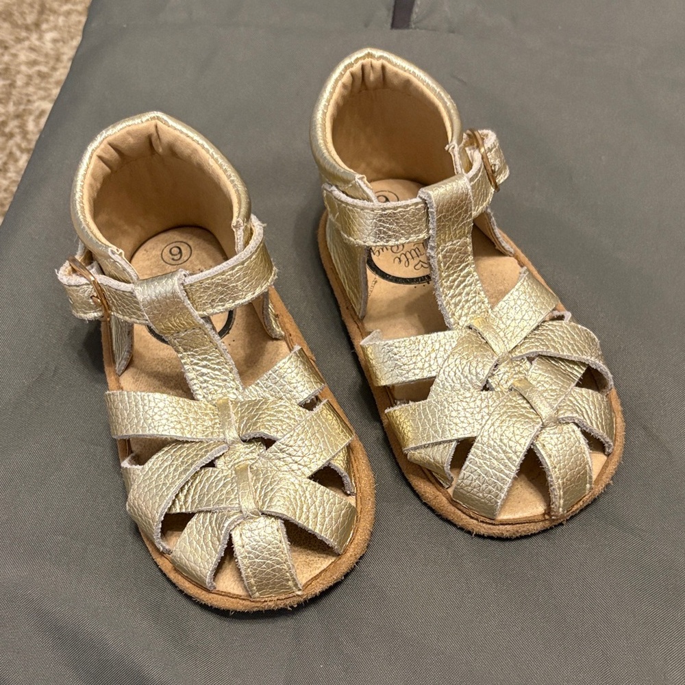 Gold moccasin style sandals